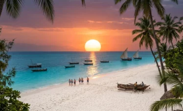 A dynamic horizontal documentary photograph capturing the specific, unique features of Kendwa beach, Zanzibar, during the warm golden hour before sunset. It features multiple tall coconut palm trees, a large deep turquoise lagoon with anchored traditional wooden dhow boats, wide powdery white sand with rustic woven palm-leaf umbrellas and a small fire pit, and a distant couple walking barefoot along the water's edge. Natural golden light filters through the palms.