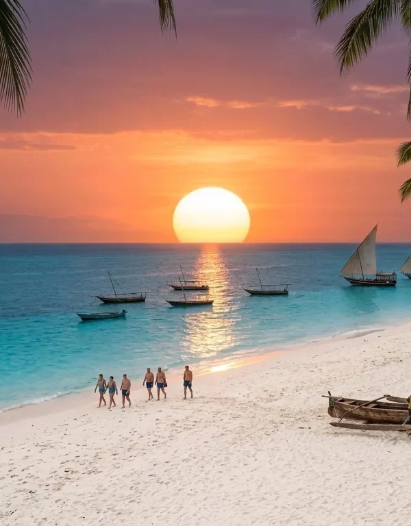 A dynamic horizontal documentary photograph capturing the specific, unique features of Kendwa beach, Zanzibar, during the warm golden hour before sunset. It features multiple tall coconut palm trees, a large deep turquoise lagoon with anchored traditional wooden dhow boats, wide powdery white sand with rustic woven palm-leaf umbrellas and a small fire pit, and a distant couple walking barefoot along the water's edge. Natural golden light filters through the palms.